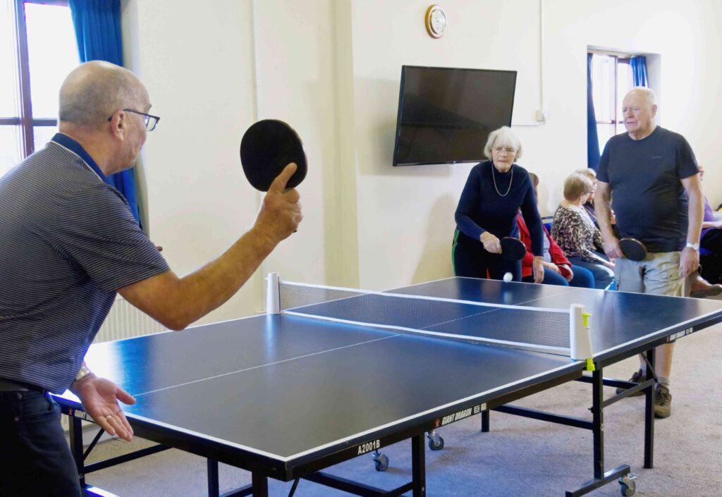 A game of table tennis is being played